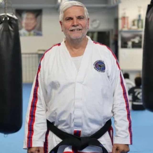 Dr. Grandmaster Kwan Jang Nim Cariati, IX Dan, in his dobok and black belt